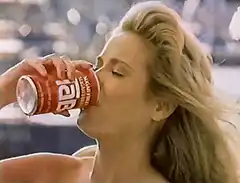 Blonde woman drinking 1664 beer