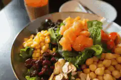 Salad with dressing being poured