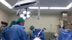 Surgeon dancing with surgical tool