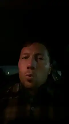 man in car at night