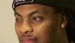Man in beanie looking skeptical