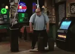 Emo Phillips dancing in a bar