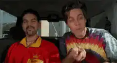 Two men eating in a car