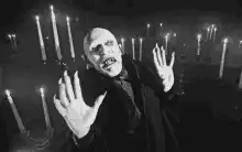 Bela Lugosi as Dracula reaching out