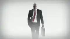 Agent 47 walking with briefcase and gun