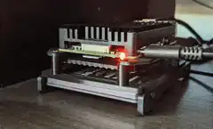 Red laser beam shooting from computer