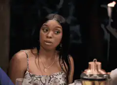 Woman's eyes widen in shock