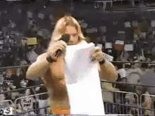 Wrestler reads letter in ring