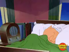Porky Pig wakes up in bed