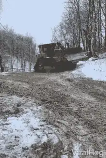 CAT bulldozer plowing snow