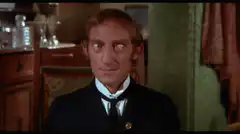 Man with wide eyes looking sideways