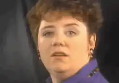 Woman looking confused and saying what