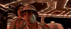 Two men dance in a casino