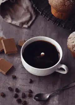 Milk drop in black coffee
