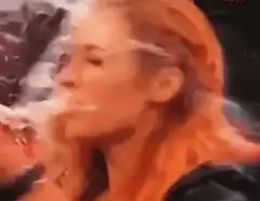 Woman exhaling smoke in profile