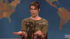 Bill Hader shrugs and covers face