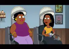 Two women under hair dryers talking