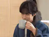 Man drinking from a mug