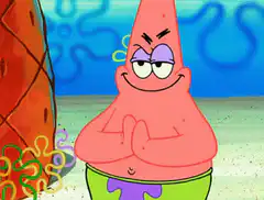 Patrick Smug with Hands Clasped