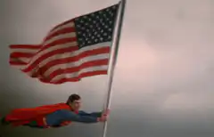 Superman holding an American flag