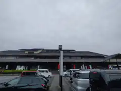 Japanese building with cars in parking lot