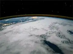 Earth rotating in space with city lights