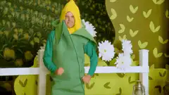 Man in corn costume dancing
