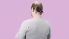 Man puts hair in ponytail always ready