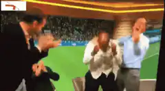 Two men celebrating wildly in a stadium