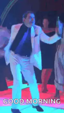 Man in white suit dancing with GOOD MORNING text
