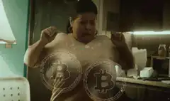 woman flexing with bitcoin on chest