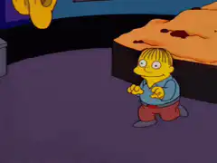 Ralph Wiggum sneaking up on a cake
