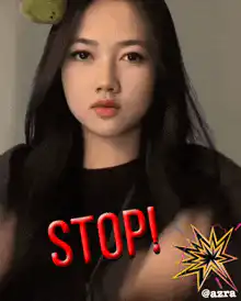 Woman holding up hands saying stop