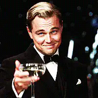 Leonardo DiCaprio toasting with a drink