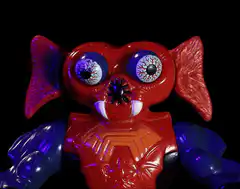 Red monster toy with popping eyes