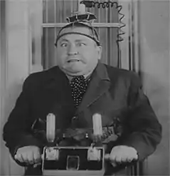 Man with electric shock machine