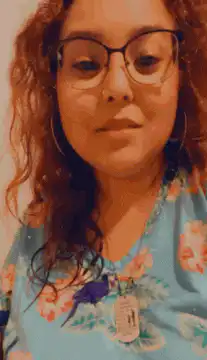 Woman with glasses and floral shirt