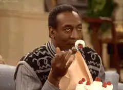 Bill Cosby eating cake