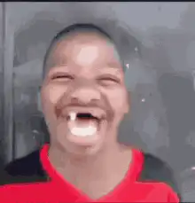 Boy laughing with vampire teeth filter