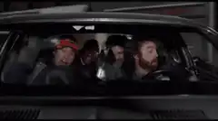 Four guys screaming in a car
