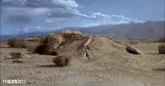 Giant worm bursts from desert ground