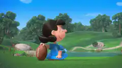Lucy kicks Charlie Brown