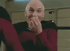 Captain Picard smirking and laughing