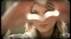 Taylor Swift looking through fingers