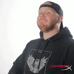 Man in HyperX hoodie makes finger gun gesture