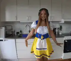 Woman in Snow White costume dancing in kitchen