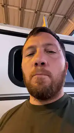 Man with beard looking at camera