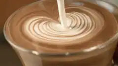 Latte art heart being poured