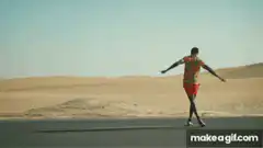 Man dancing in desert with colorful backgrounds