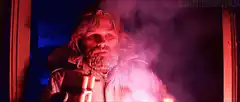 Bearded man with dynamite in smoke